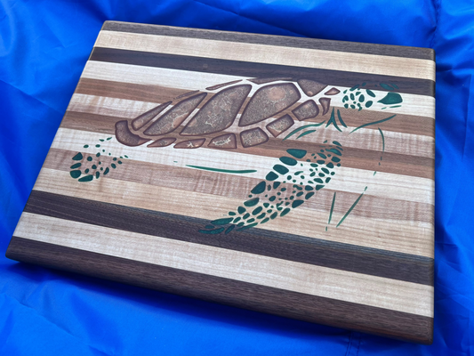 hardwood charcuterie board with sea turtle epoxy inlay